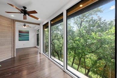 Unfurnished sunroom with wood walls, healthy amou