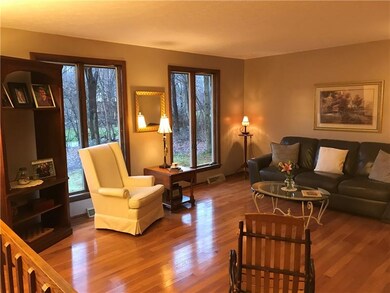 Living room featuring large windows and newer hick