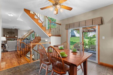 The staggered staircase includes metal spindles an