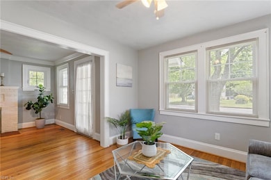 Bright & sunny Living Room w/beautiful hardwood floors.