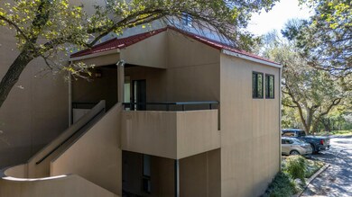 View of home's exterior featuring a tiled roof