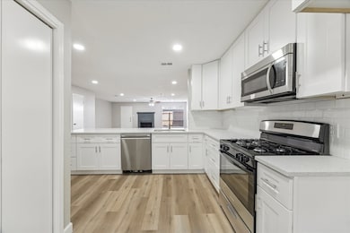 A closer look at the beautifully crafted cabinets with gorgeous quartz countertops.