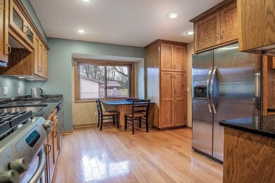Kitchen offers abundant cabinetry, granite counter