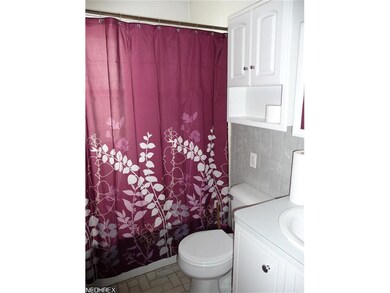 Nicely remodeled bath with fibrtglas tub surround.