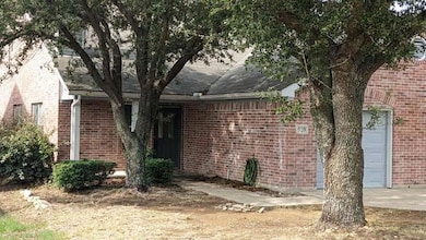 View of side of home with a garage