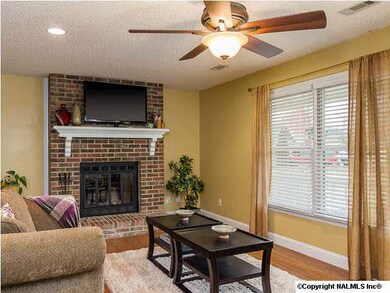 Living Room with tiled entry, ceiling fan, recessed light with dimmer