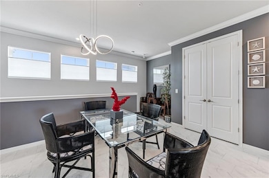 Dining room featuring crown molding and plenty of 