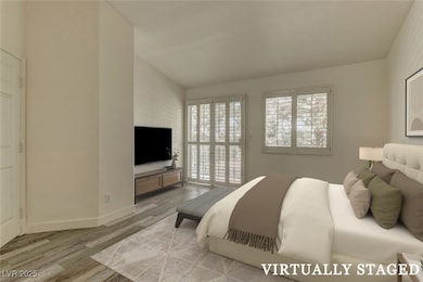 Virtually Staged; Bedroom featuring wood finished