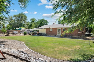 View of yard with entry steps and a patio area
