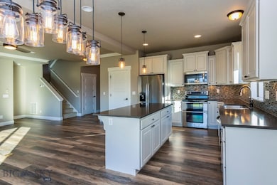 Kitchen with, quartz counters, SS appliances