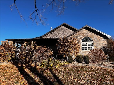 View of home's exterior with stone siding