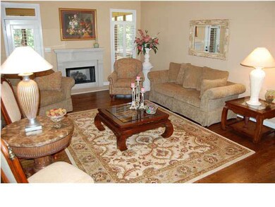 Great room with vaulted ceiling features hardwood 