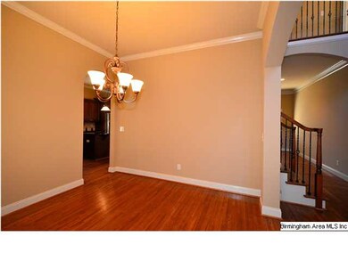 Spacious dining room ready for family dinners.