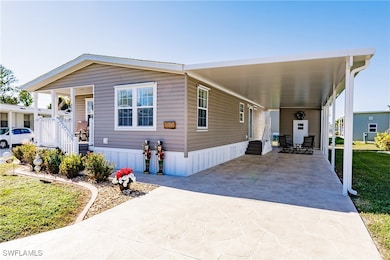 Home with a front yard and a carport