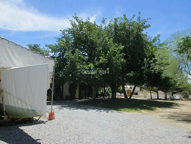 Yard/Garden. Shades front of home has RV sewer dis
