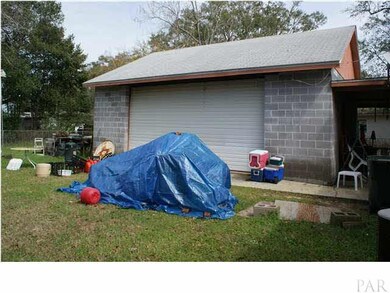 Large garage out back with ample storage for lots of treasures