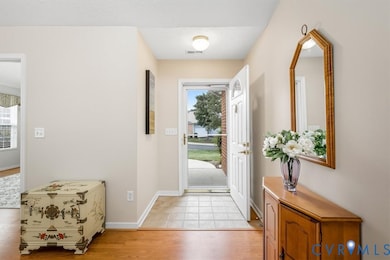 Entrance foyer featuring light wood finished floors and baseboards