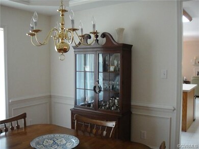 Large Dining Room with mouldings, tray ceiling, ch