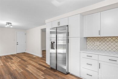 Kitchen Pantry on each side of the refrigerator