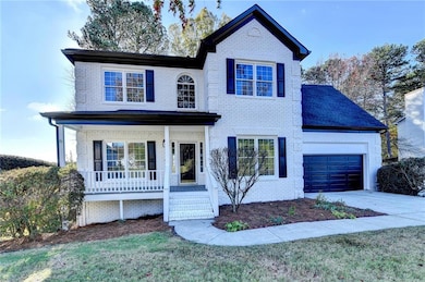 Traditional-style home with concrete driveway, an 
