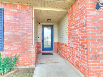 Doorway to property with brick siding
