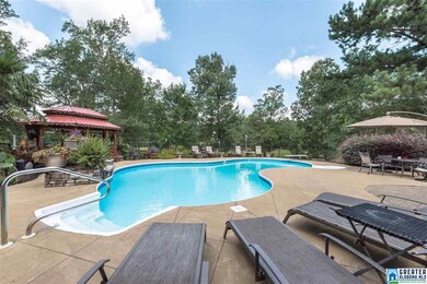 INCLUDES 8 FOOT DEEP POOL WITH DIVING BOARD, WATER