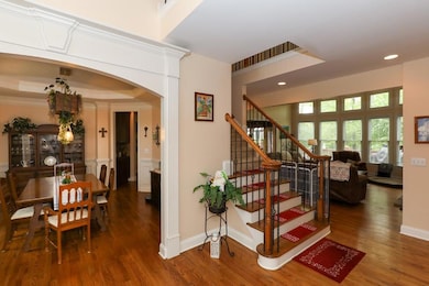Staircase with recessed lighting, wood finished fl