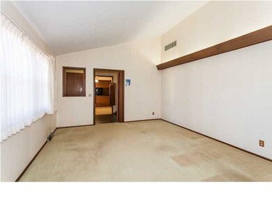Living room looking into kitchen/dining