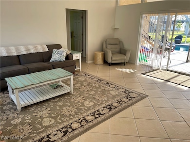 Living area featuring tile patterned flooring and