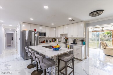 Kitchen with marble finish floor, visible vents, a