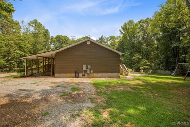 View of side of property with a yard
