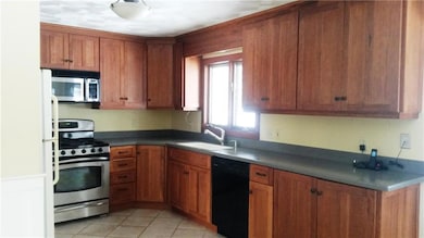 Updated kitchen with beautiful cabinets.