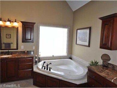 Master Bath/Spa. The master suite s Ritz Carlton styled bath offers handsome His & Her custom vanities, a large jetted tub and an over sized walk-in shower as well as big walk-in closet and en suite linen closet.