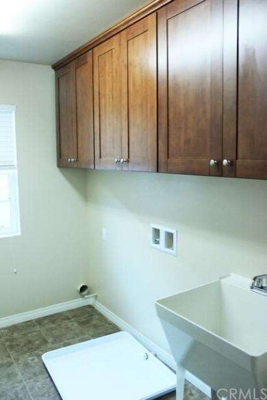 Large laundry room with deep wash basin.