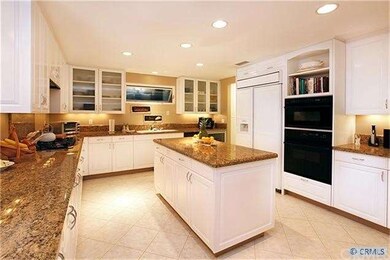 Gourmet kitchen with granite counters, custom cabi