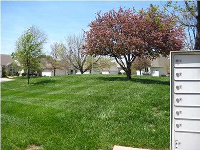 Center island greenbelt beyond the mailbox.