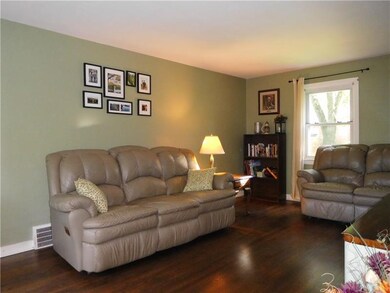 The living room features lots of natural lighting 
