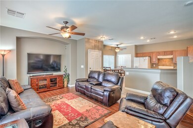 Cozy living room features laminate wood floors.