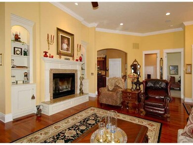 Family Room. Twelve foot ceilings and polished che