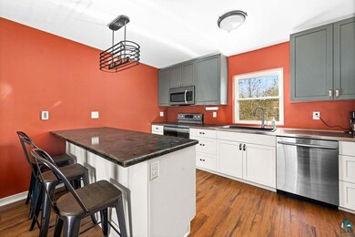 Kitchen featuring pendant lighting, sink, a kitche