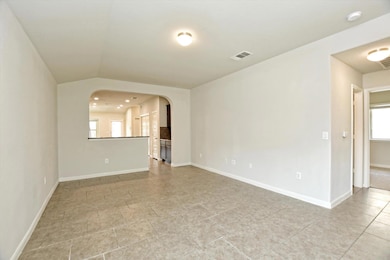Spare room with a smoke detector, arched walkways