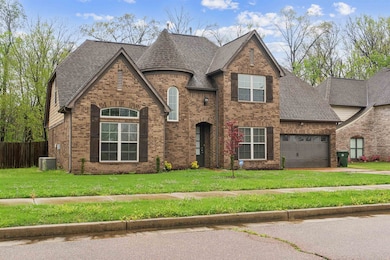View of front of property featuring cooling unit, 