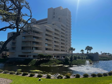 View of apartment building / complex with a water view
