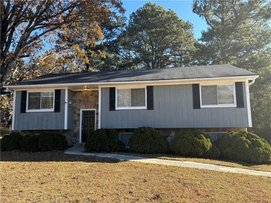 Raised ranch featuring a front lawn