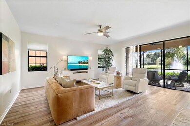 Living room featuring light wood-style floors and ceiling fan