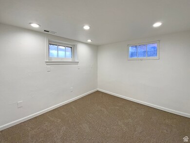 Basement with carpet flooring and recessed lighting
