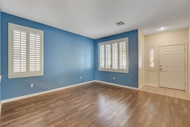 Formal living room with large, open windows.