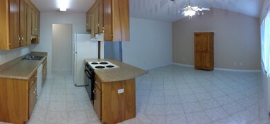 Kitchen opens up to living room and dinning area.