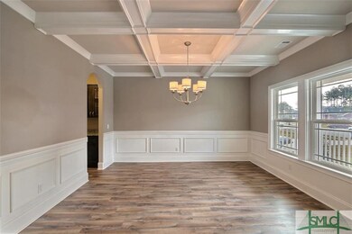 Dining Room with coffered ceilings right off the f