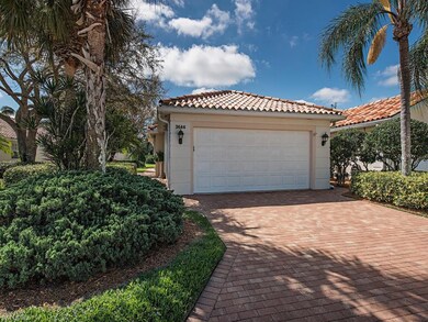 Custom brickwork graces the driveway and completel
